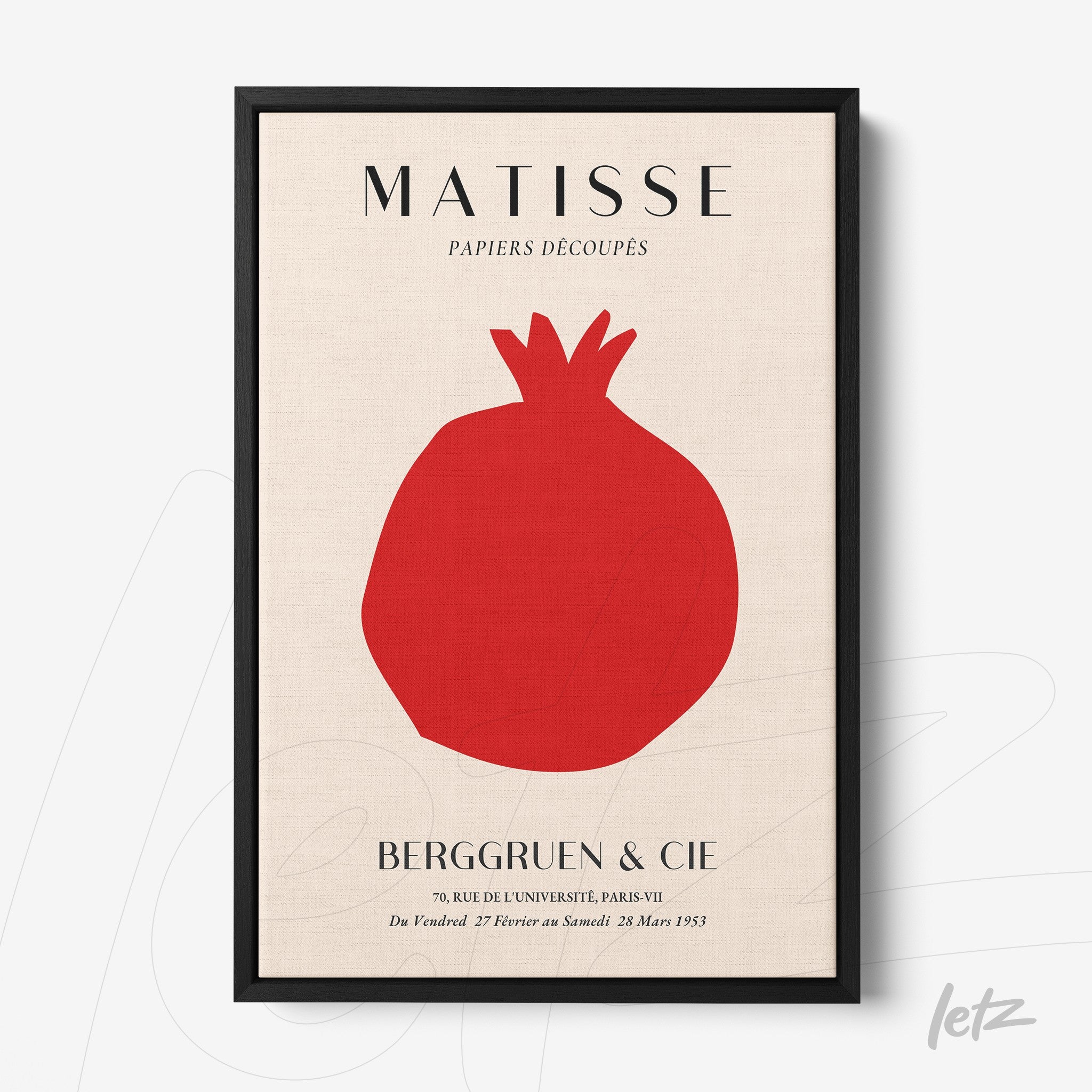 framed artwork featuring henri matisse's paper cutout of a pomegranate in red on a light background with a thin black frame