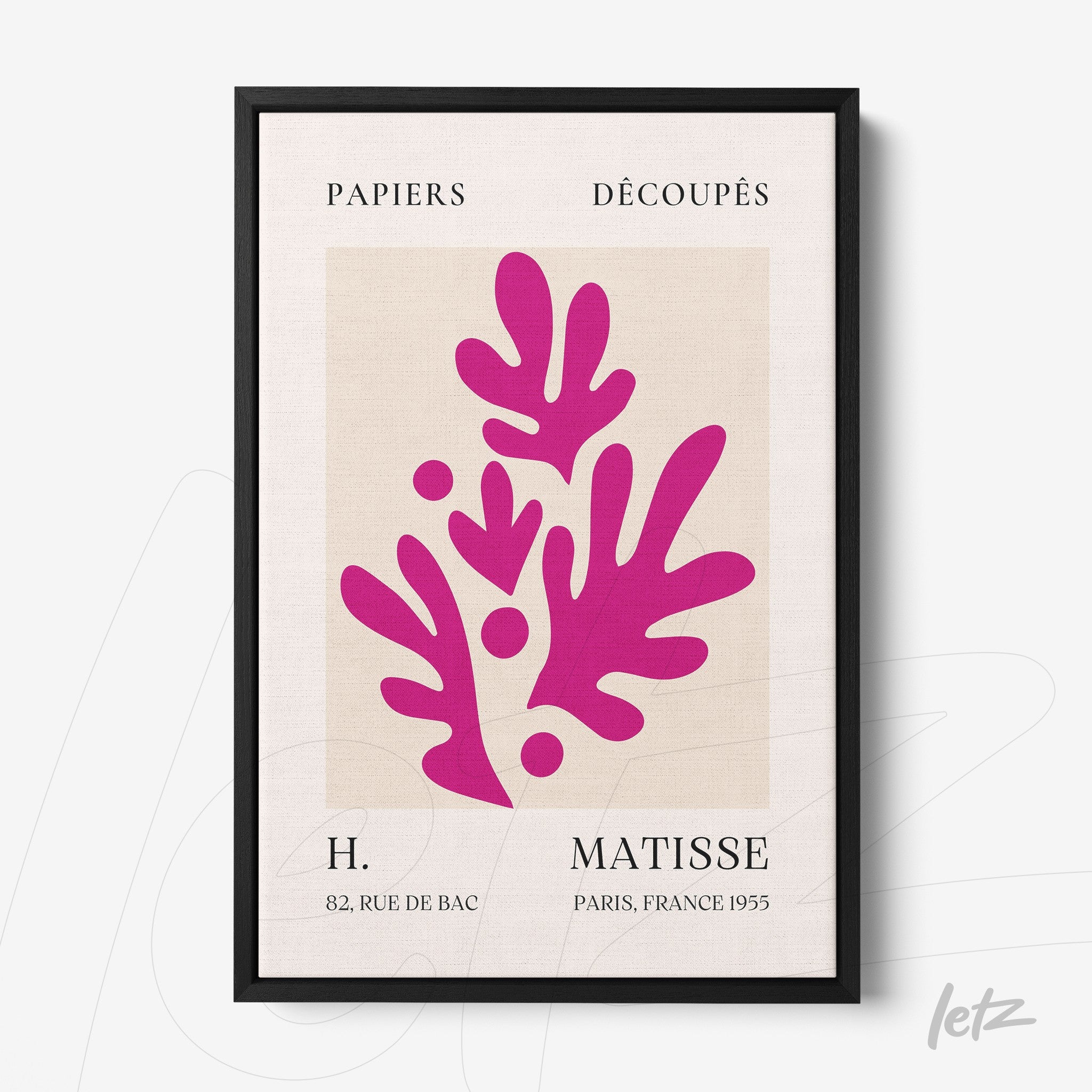 modern wall art featuring stylized leaves in vibrant pink, framed in a sleek black frame with a light background