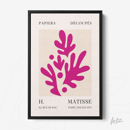 modern wall art featuring stylized leaves in vibrant pink, framed in a sleek black frame with a light background