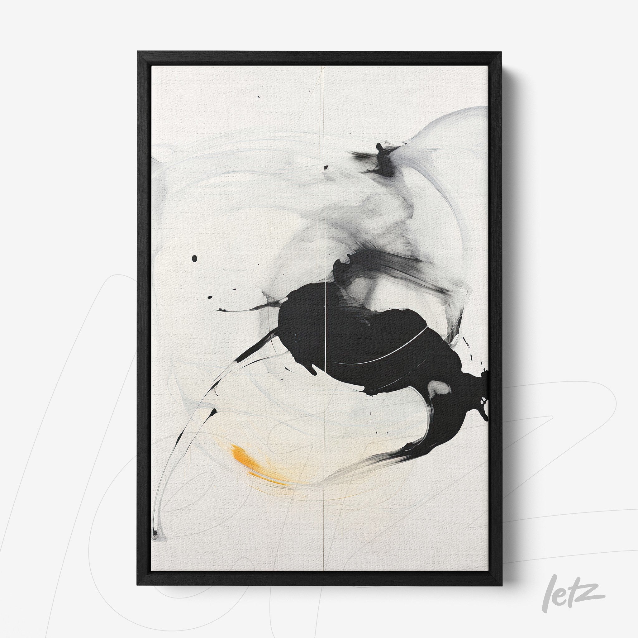 abstract wall art in black, white, and hints of yellow with a black frame
