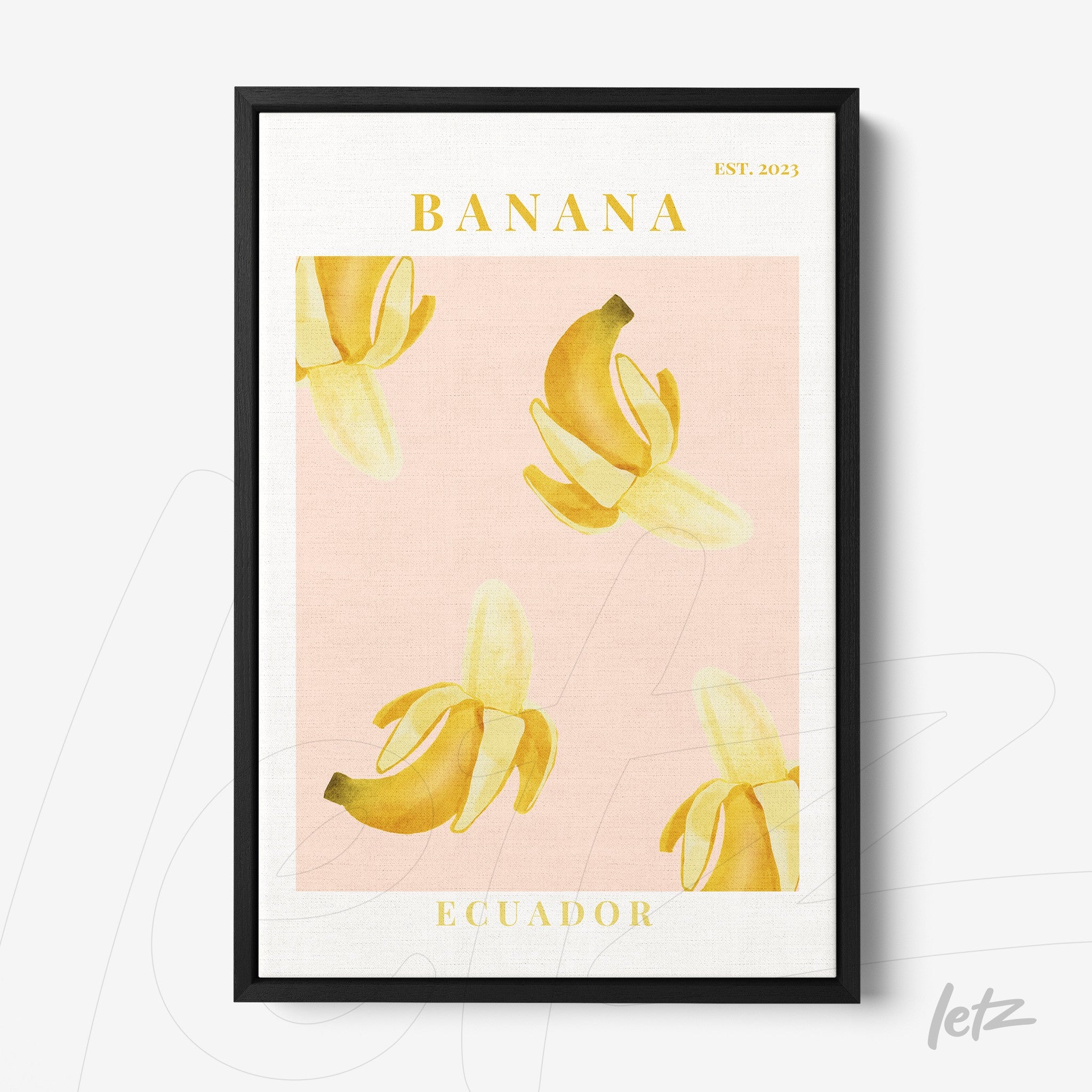 framed art of bananas on a light pink background with black frame