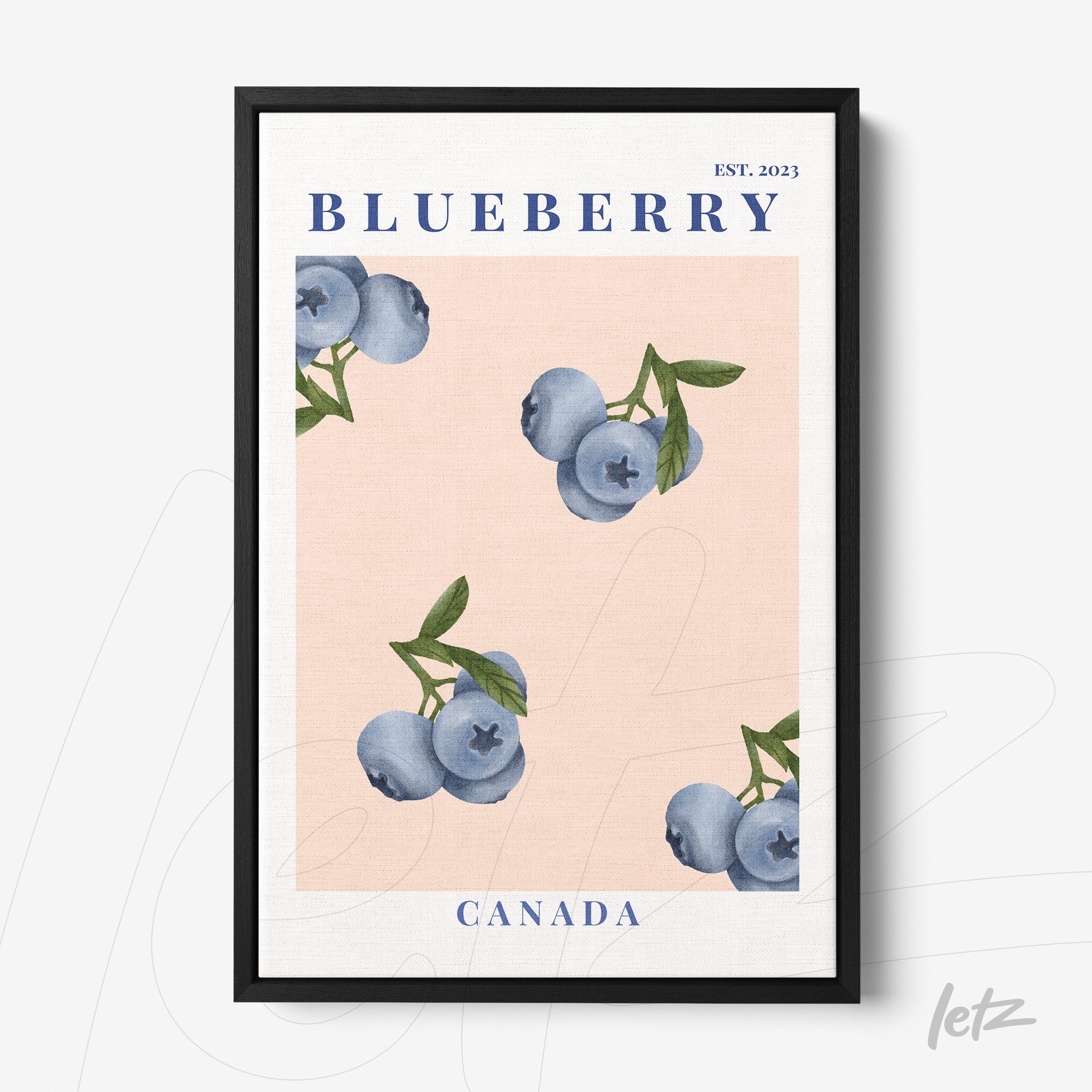 framed wall art featuring blueberries on a light pink background with black frame