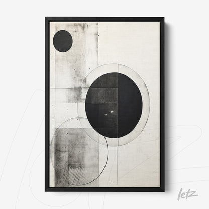 abstract wall art in black and white featuring circles and geometric shapes in a black frame