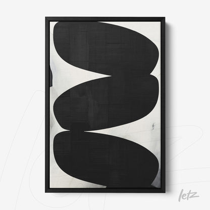 abstract black and white wall art featuring oval shapes in a slim black frame