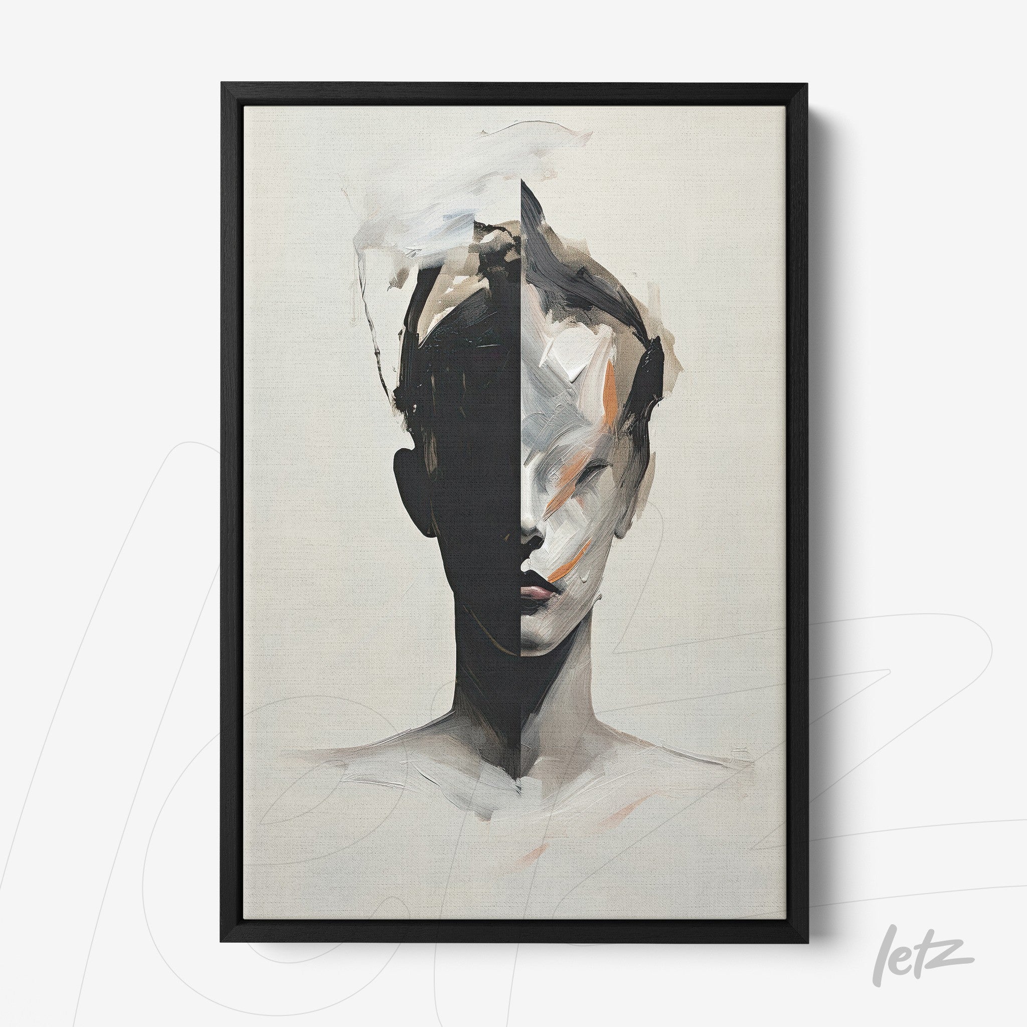 framed abstract art of a split human face in neutral tones