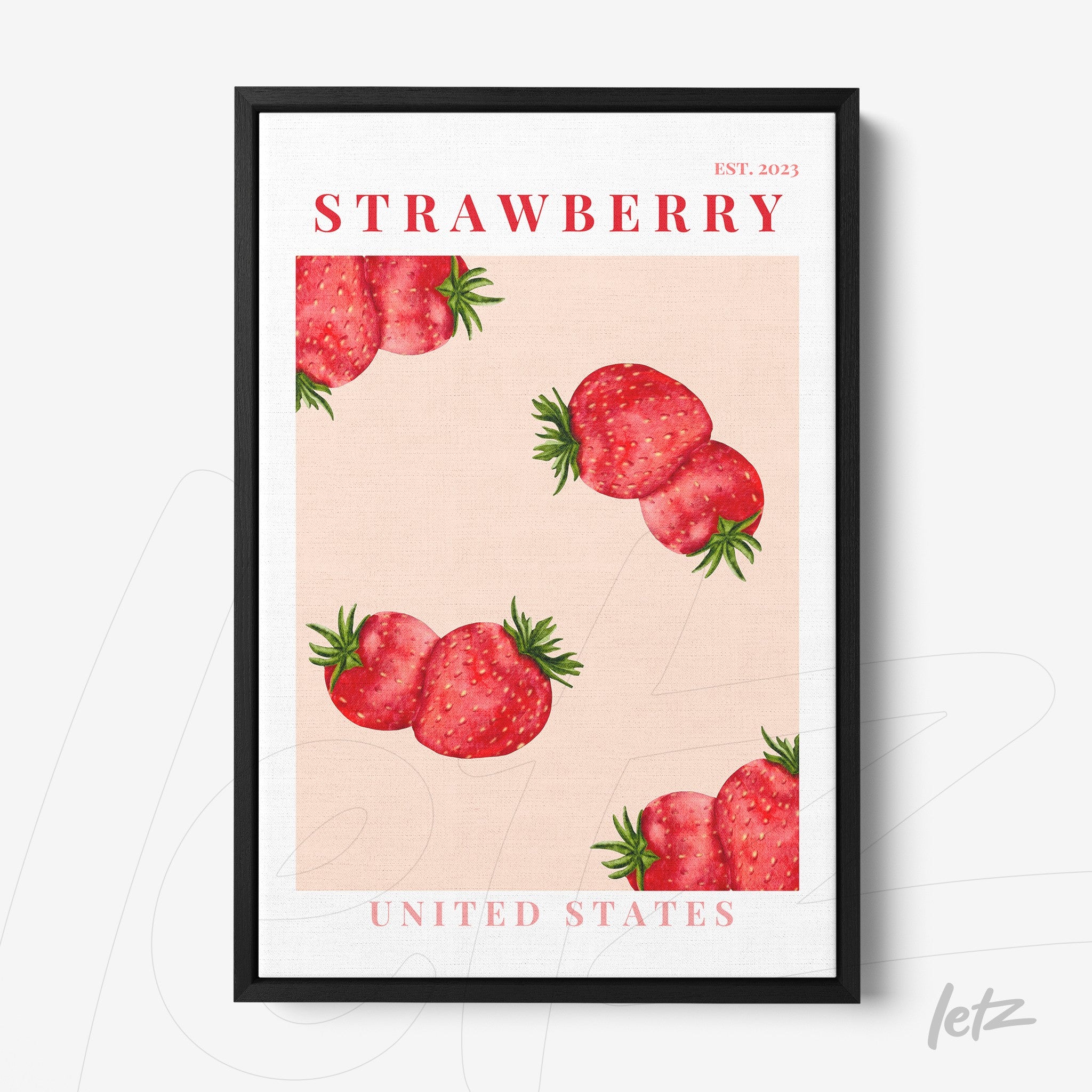framed artwork featuring strawberries on a pink background with black frame