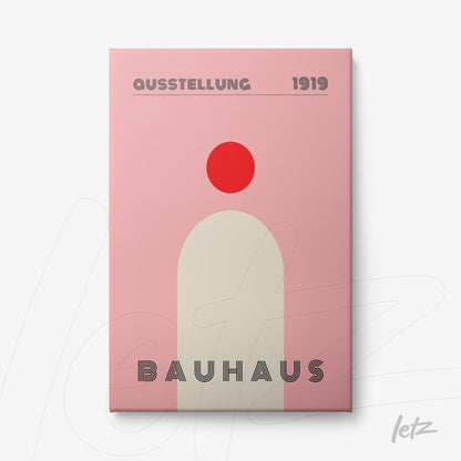 canvas art in Bauhaus style featuring minimalist geometric shapes in pink and red, displayed on a light background