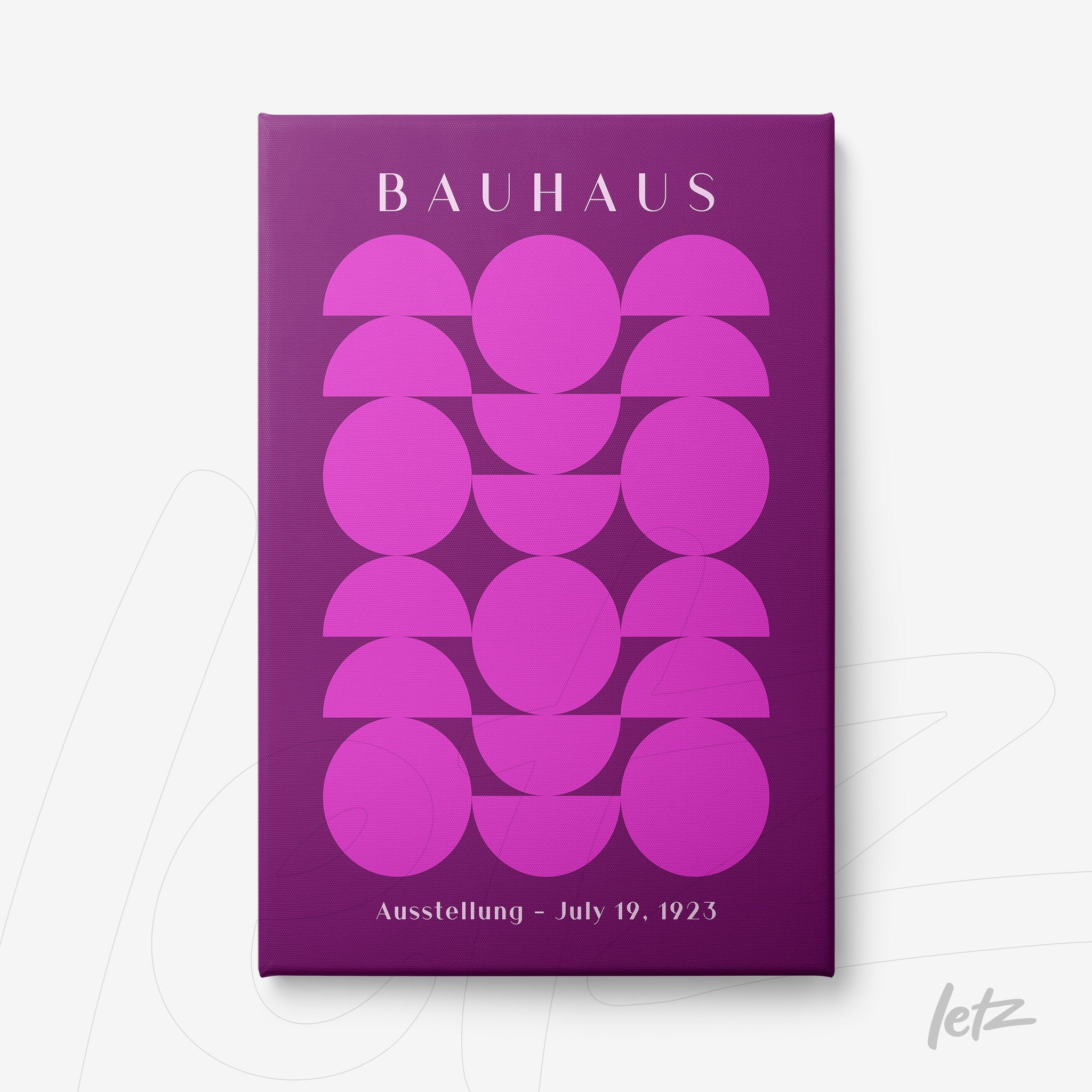 canvas print featuring geometric art in purple and pink tones with text 'Bauhaus' and date 'July 19, 1923' on a purple background