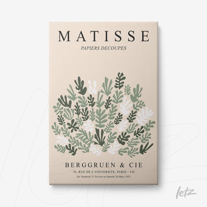 framed wall art featuring a composition of leaves and flowers in shades of green and white on a light beige background