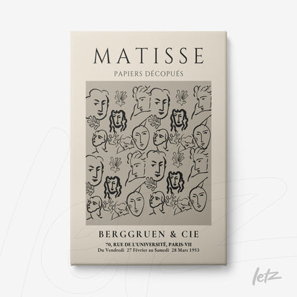 framed artwork featuring a minimalist design of stylized faces on a light background with a neutral frame