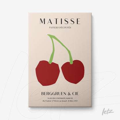 framed modern art featuring red cherries on a cream background with white frame
