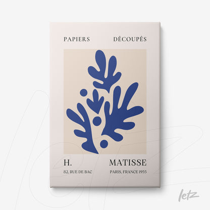 modern artwork featuring blue organic shapes on a beige background with a light frame