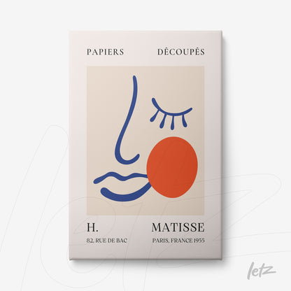 framed modern artwork in minimalist style featuring a stylized face with blue lines and a red circle on a cream background