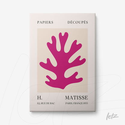 framed art print of a pink paper cut-out coral shape on cream background with white frame