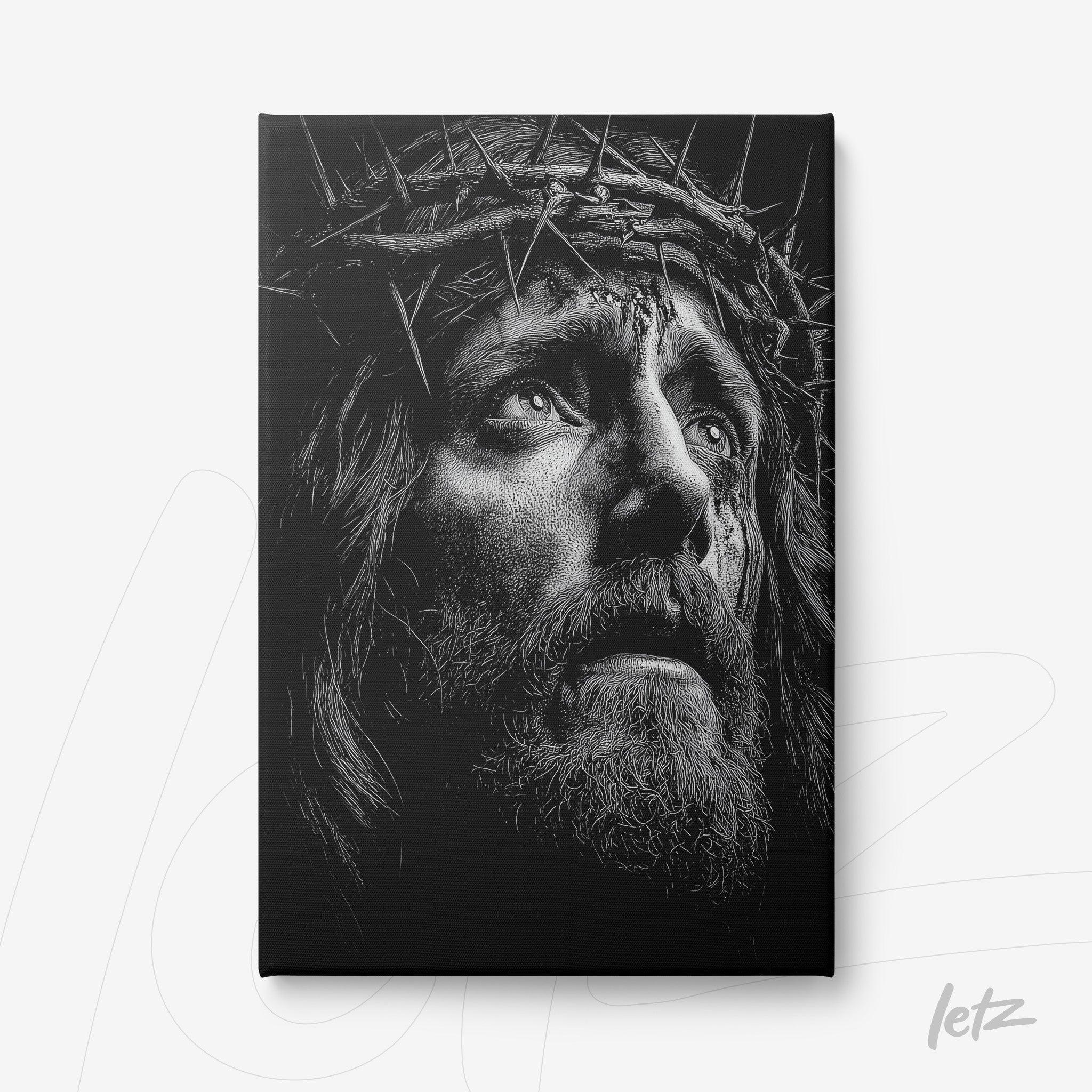 canvas print featuring a black and white portrait of Jesus Christ wearing a crown of thorns with an expression of agony
