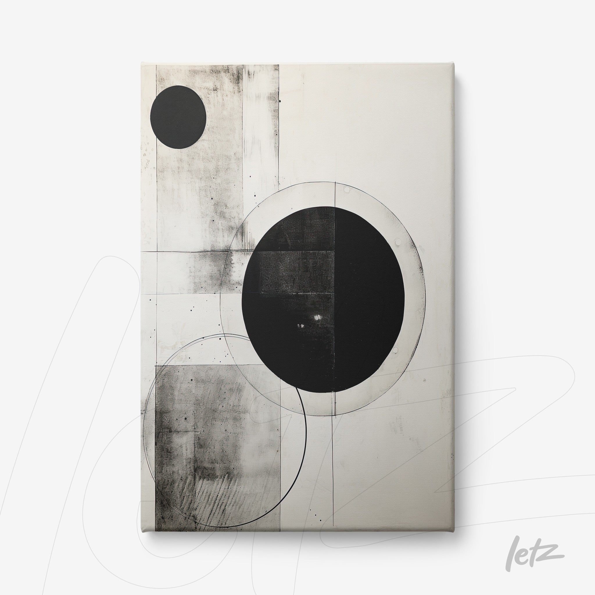 canvas art featuring abstract black and white design with large and small circles on a light background