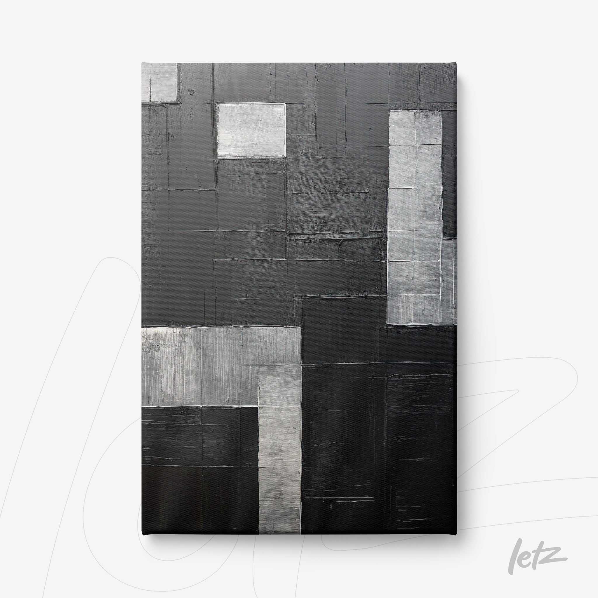 canvas artwork featuring abstract design in shades of black and gray with various textures and finishes