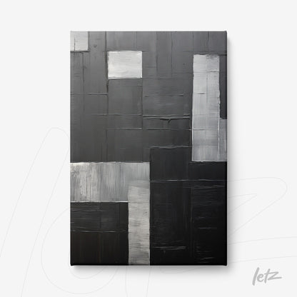 canvas artwork featuring abstract design in shades of black and gray with various textures and finishes