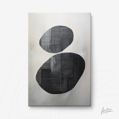 canvas artwork featuring abstract black shapes on a soft light background