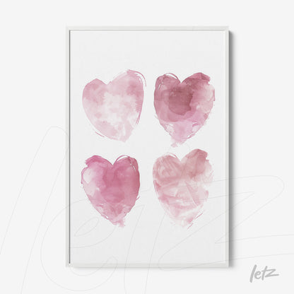 framed artwork featuring four watercolor hearts in shades of pink on a white background