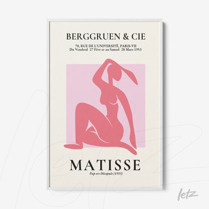 framed wall art featuring a modern style female figure in shades of pink with a white frame
