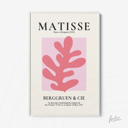 framed wall art featuring abstract pink leaf on light background with black typography