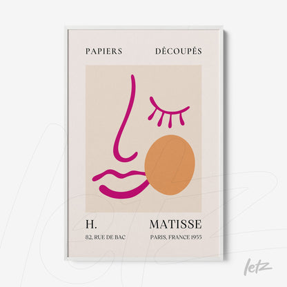 framed artwork featuring abstract face design with pink and orange lines on light background