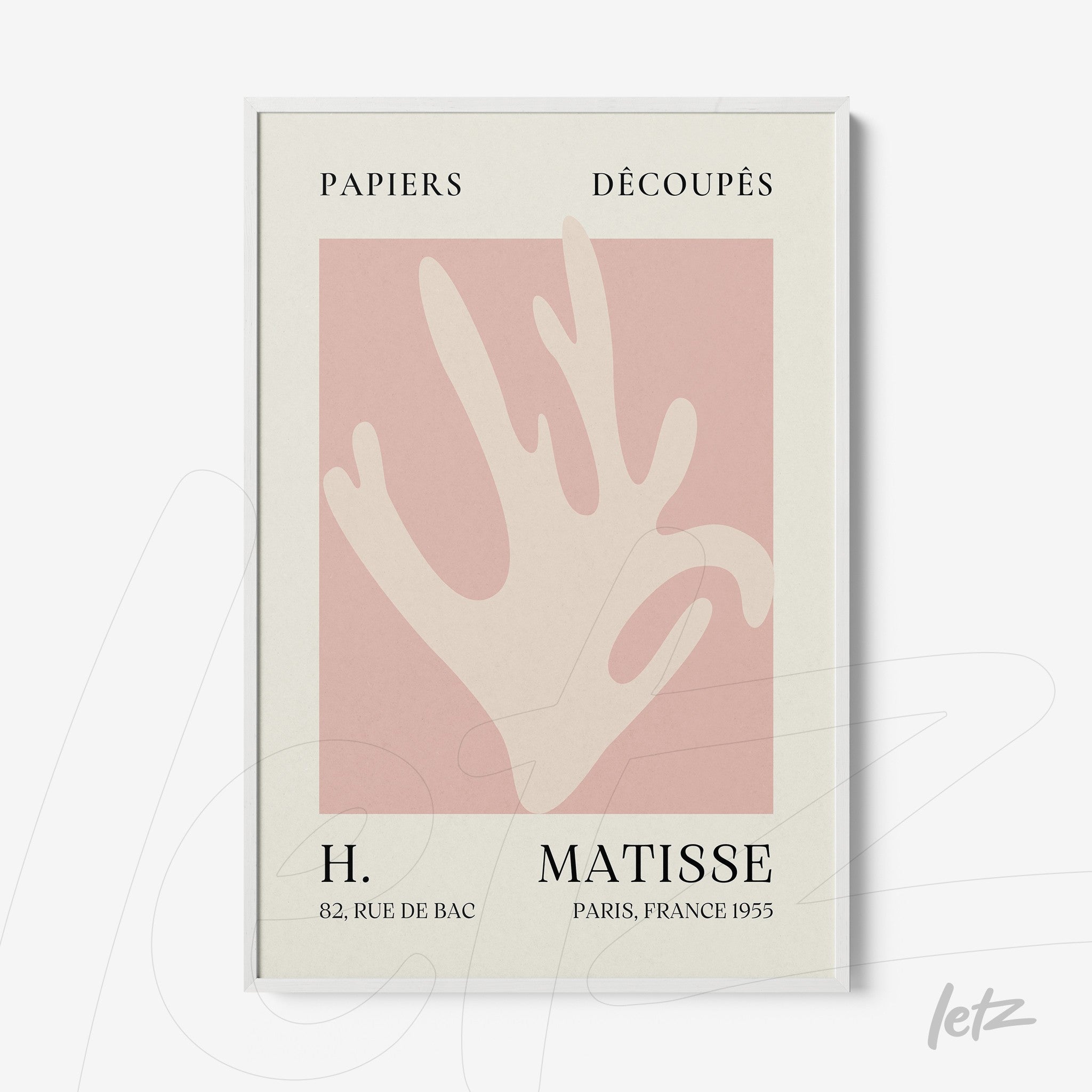 framed modern artwork featuring a stylized hand in pink tones on a light background