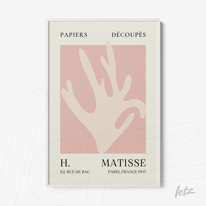 framed modern artwork featuring a stylized hand in pink tones on a light background