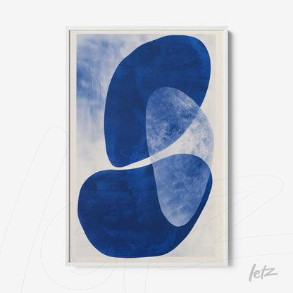 framed wall art featuring abstract shapes in shades of blue and white