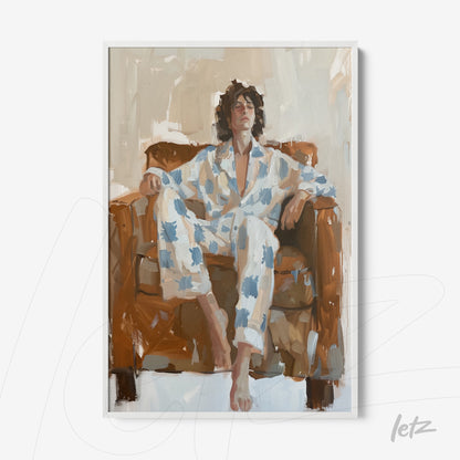 framed art depicting a man sitting on a brown sofa, wearing white pajamas with blue patches in a relaxed pose