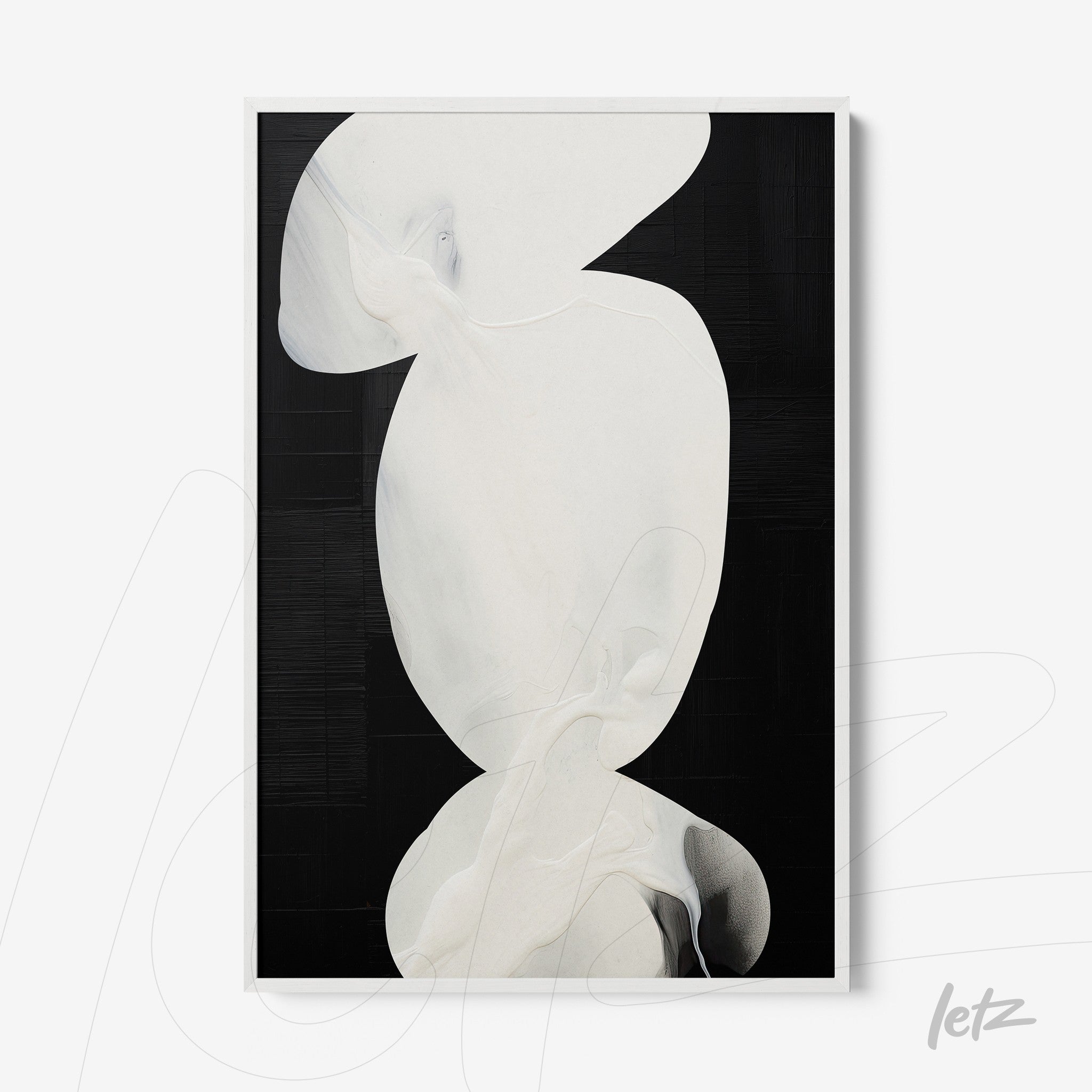 framed abstract wall art in white and black tones with a white frame