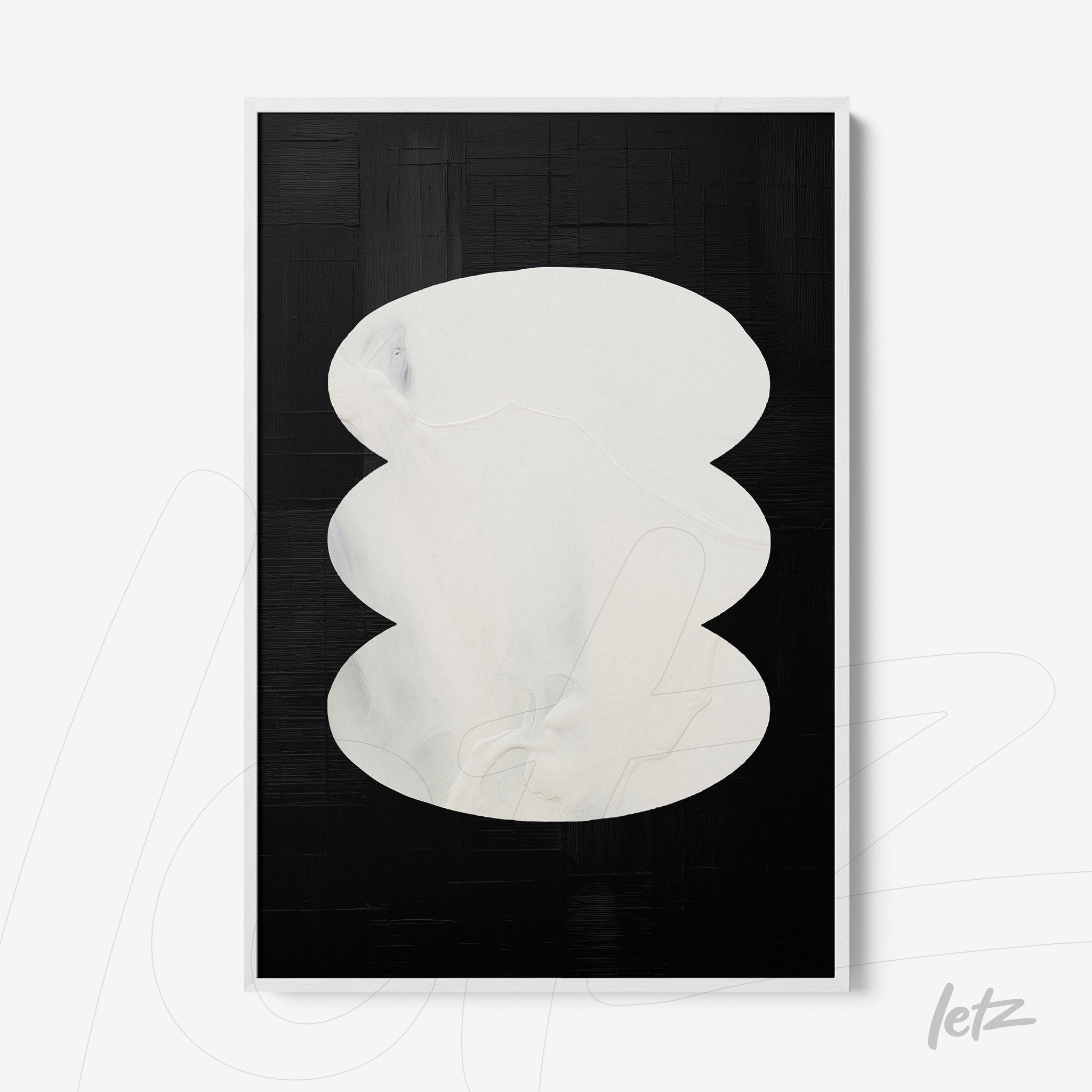 abstract wall art with overlapping white shapes on black background in white frame