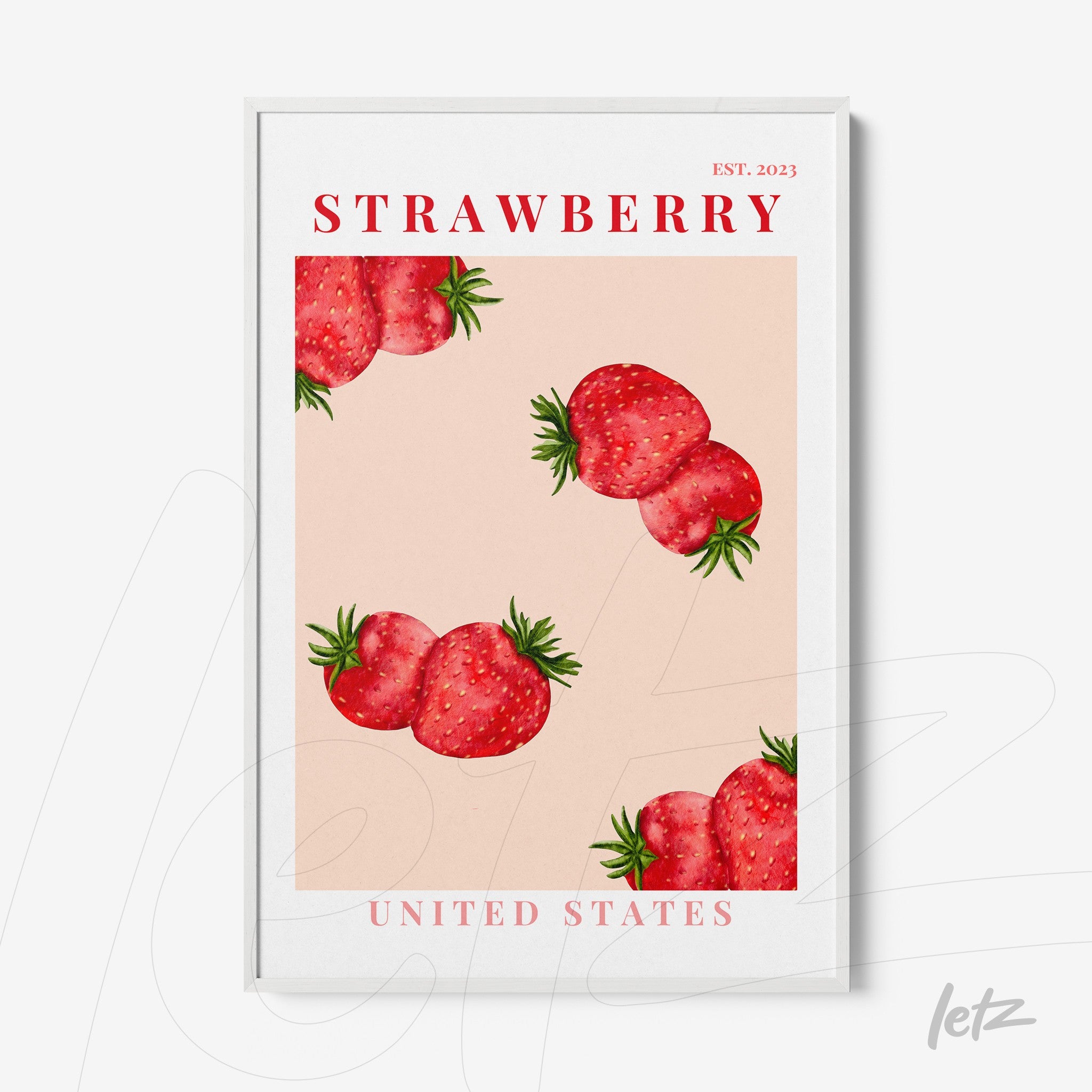 framed wall art featuring red strawberries on a pink background with a thin white frame and red text