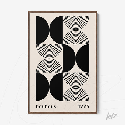 black and white geometric bauhaus style print in a dark wood frame