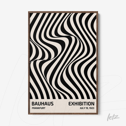 black and white geometric design print with light wood frame