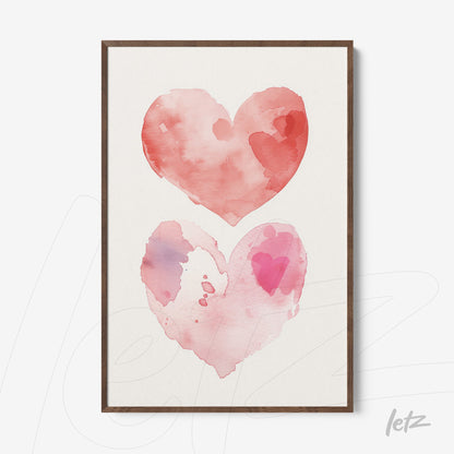 framed art print featuring watercolor illustrations of hearts in shades of pink and red with a light wood frame
