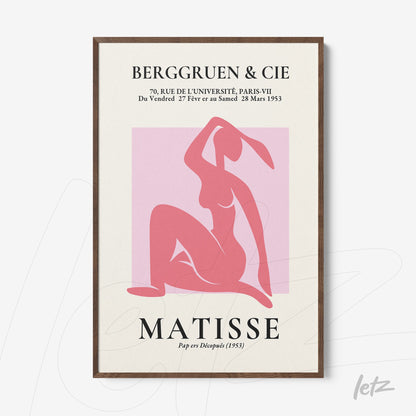 framed artwork featuring a minimalist depiction of a female figure in pink tones on a light background with French text