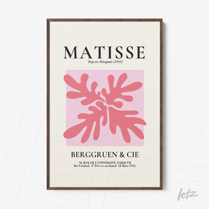 framed modern art print of pink leaves with dark wood frame and pastel color background