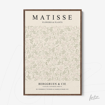 framed wall art featuring floral and plant patterns on a light background with dark wood frame