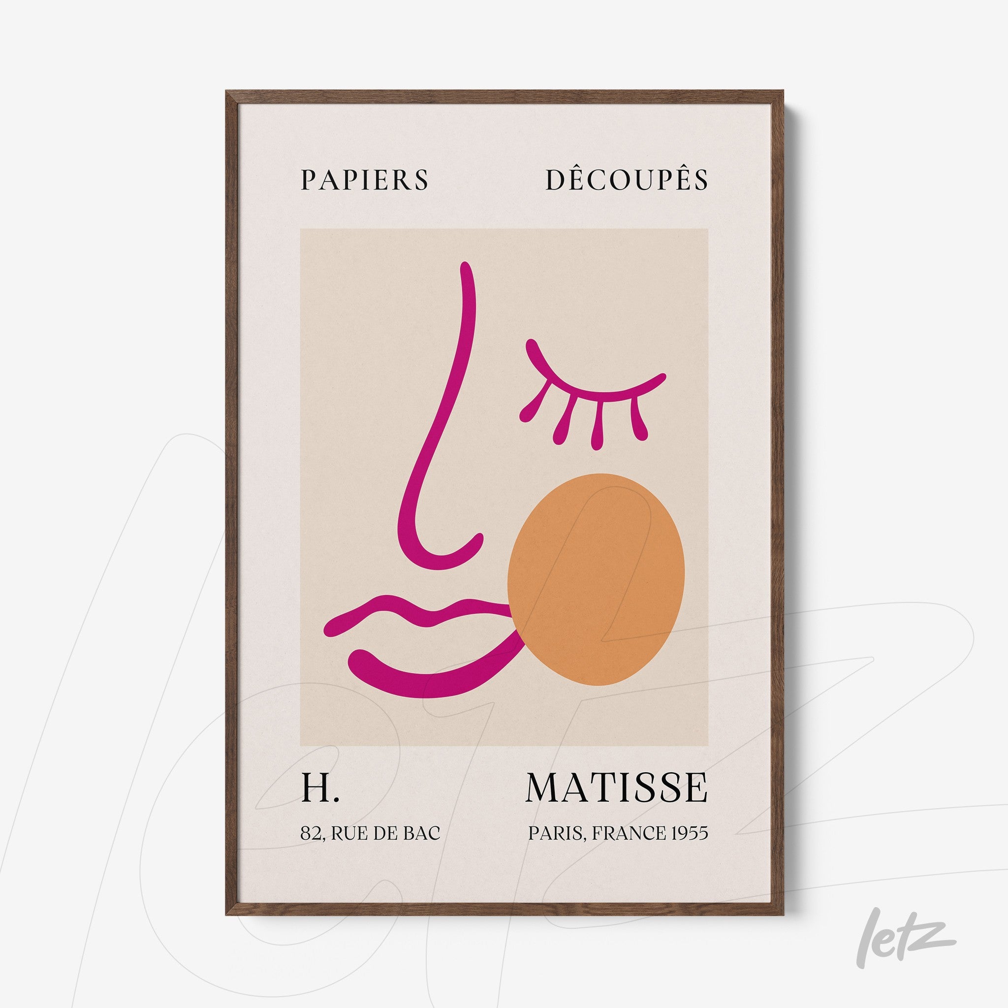 framed wall art featuring minimalist illustration on light background with pink and orange lines forming a stylized face, dark wooden frame