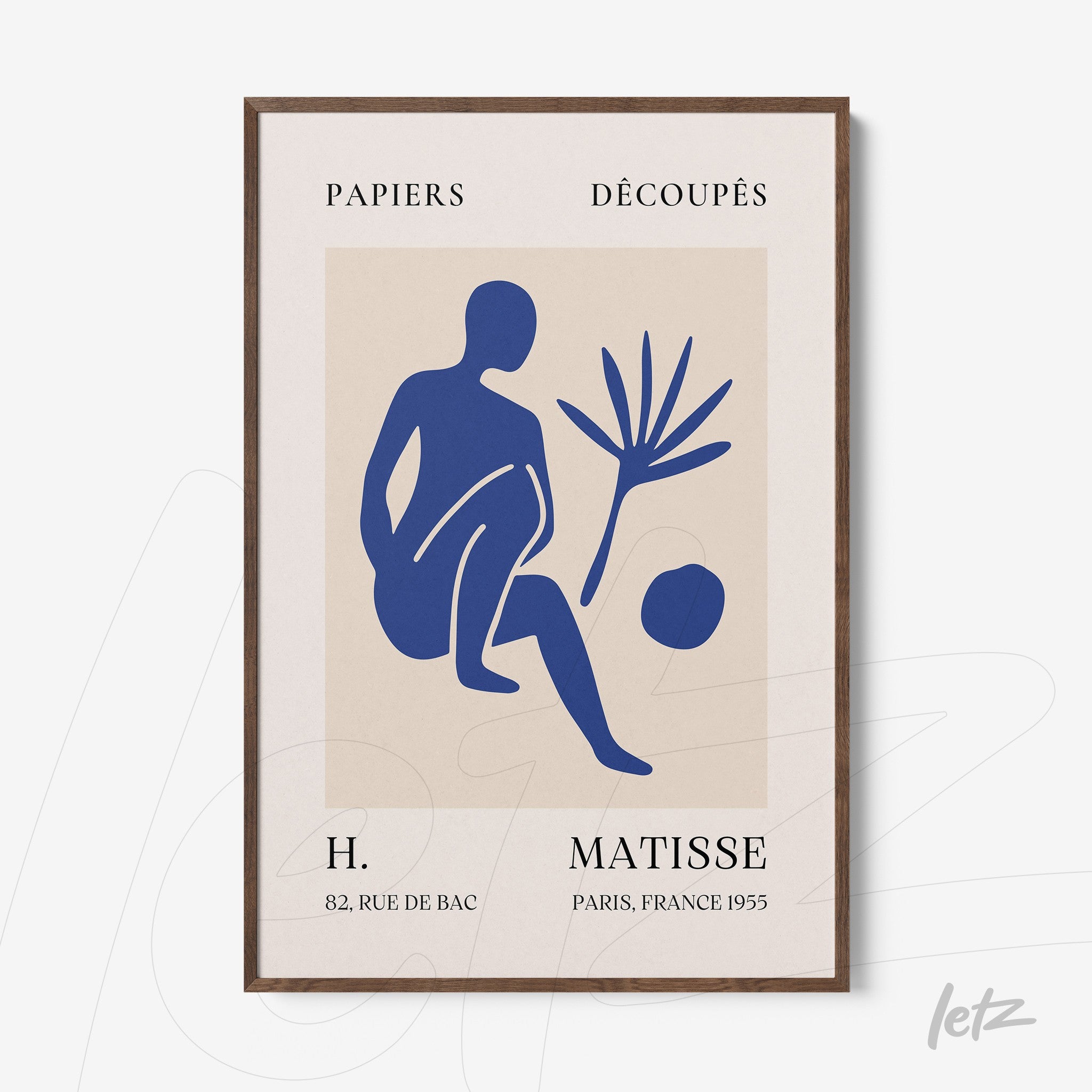 framed artwork featuring a stylized blue figure sitting next to a plant and a ball with a dark brown frame