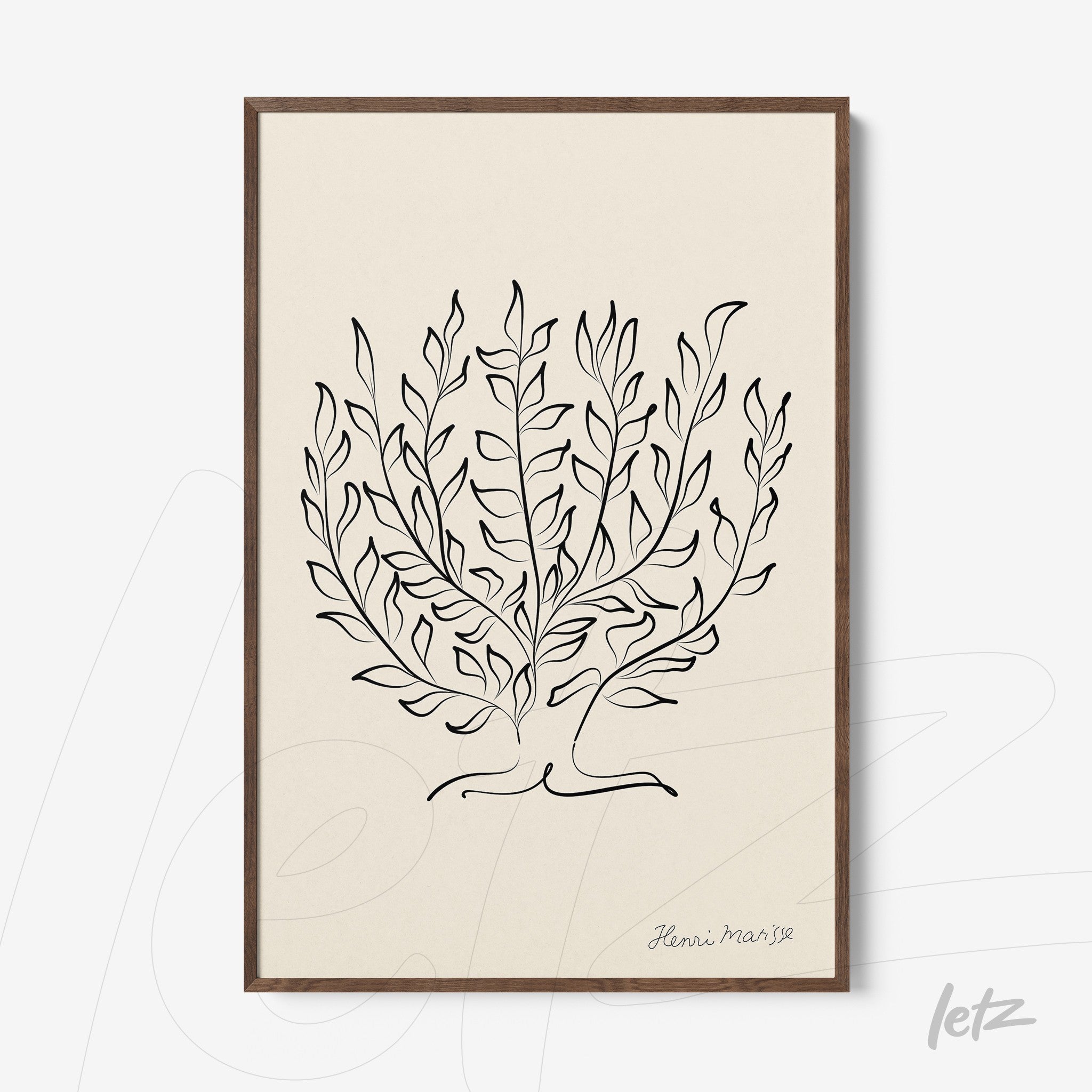 framed wall art featuring minimalist illustration of foliage in black lines on light background with dark wood frame