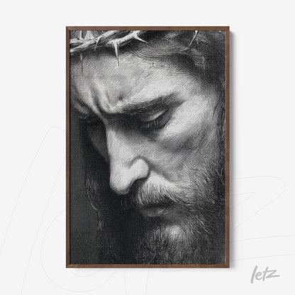 framed artwork featuring a detailed black and white portrait of a male face with a melancholic expression and dark wood frame