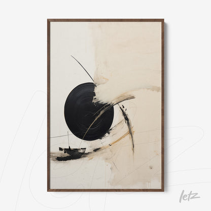 framed abstract art featuring circular black shapes on a beige background with dark wood frame