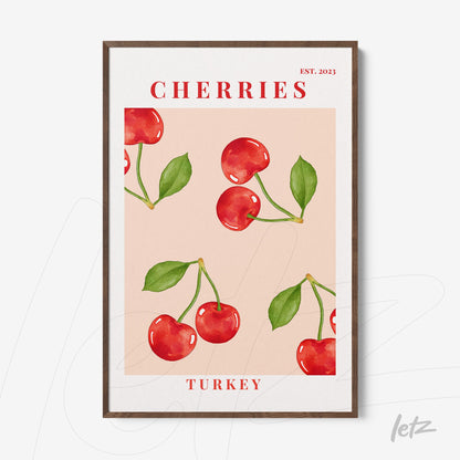 framed wall art featuring red cherries on a light pink background with dark wood frame