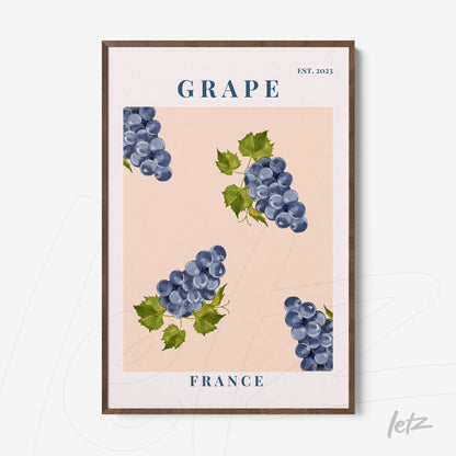 framed art print featuring large grapes on a soft pink background with dark wood frame