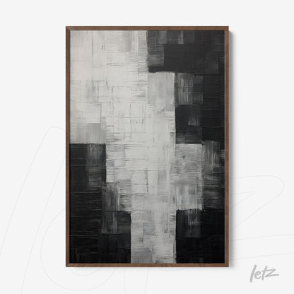 abstract artwork in shades of black and white with deep textures in dark wooden frame