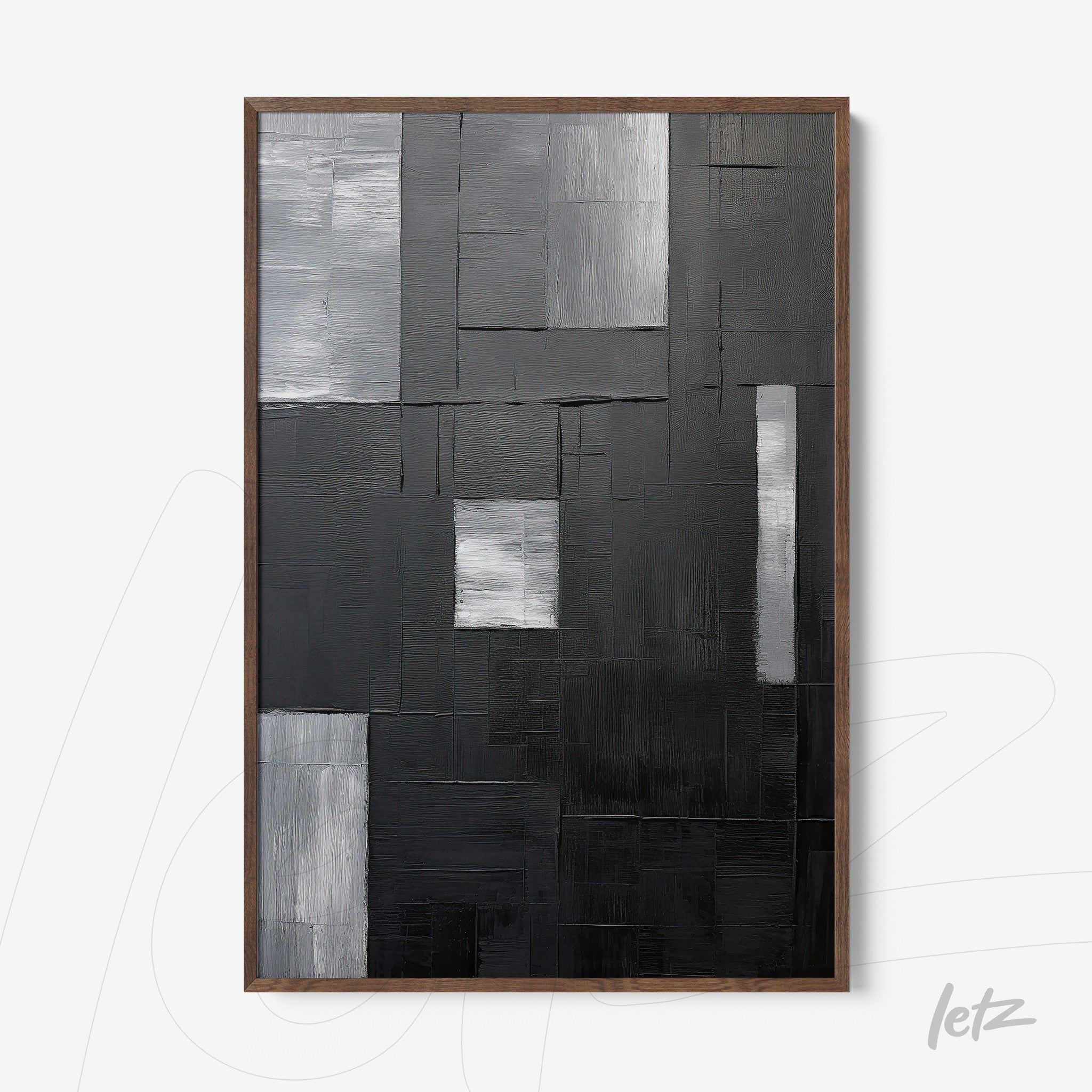 textured abstract wall art in black, gray, and silver tones with dark wood frame