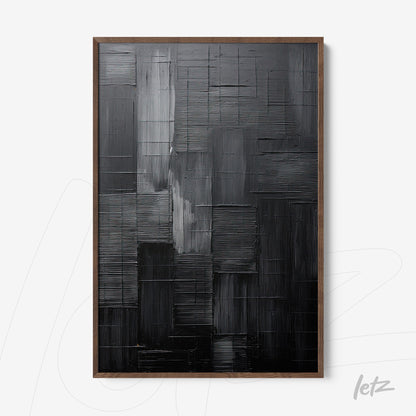 abstract black artwork featuring textured relief and dark wood frame